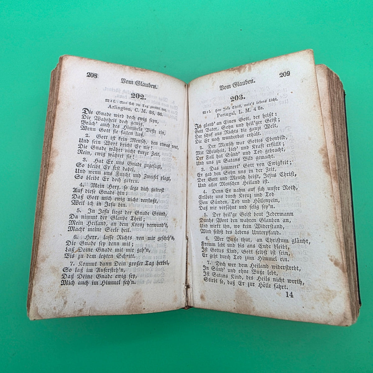 antique German-language hymn book titled Sammlung von Geistlichen Liedern, published in 1858 in Cincinnati.
