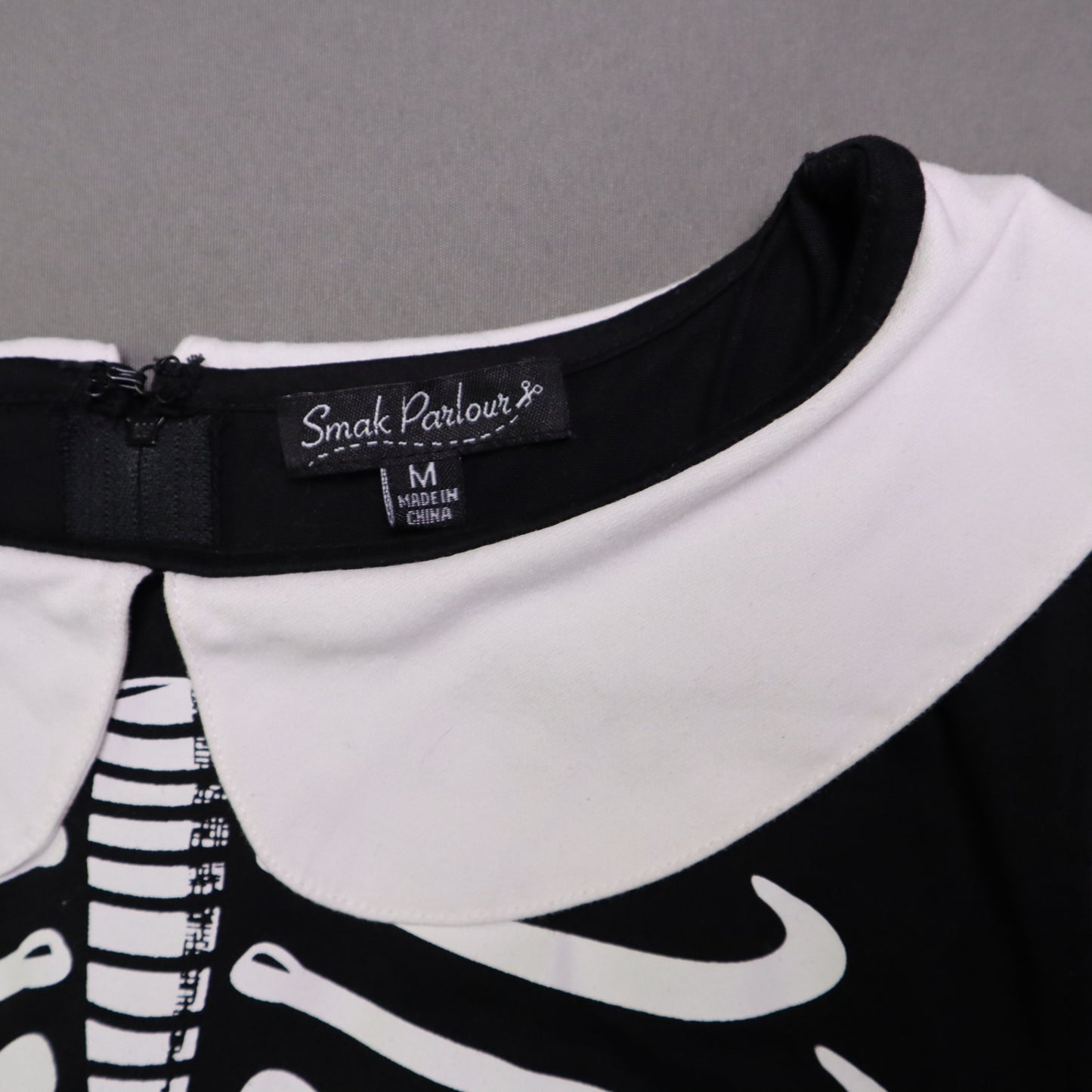 Smak Smak Parlour skeleton mod dress features a white Peter Pan collar and matching white pockets Online Only M