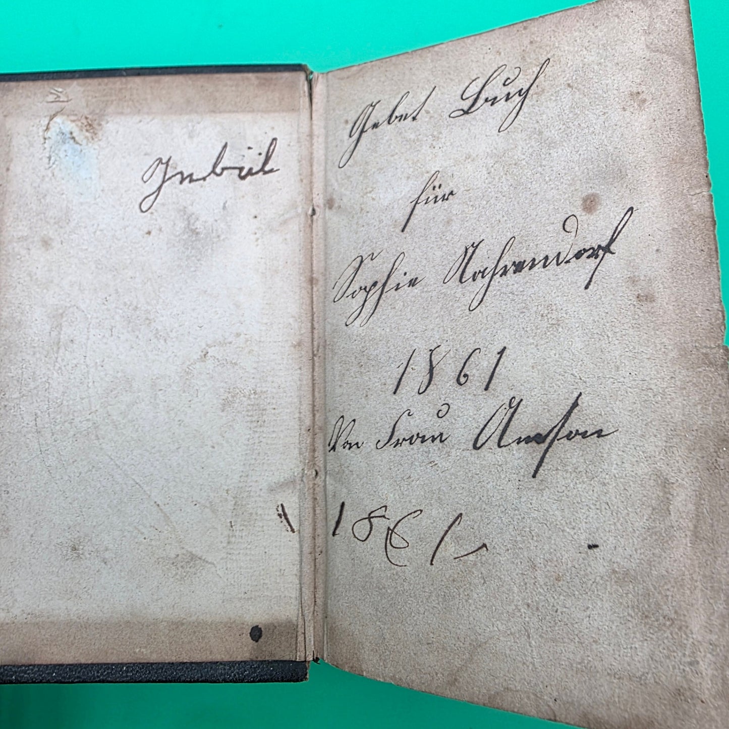 antique German-language hymn book titled Sammlung von Geistlichen Liedern, published in 1858 in Cincinnati.