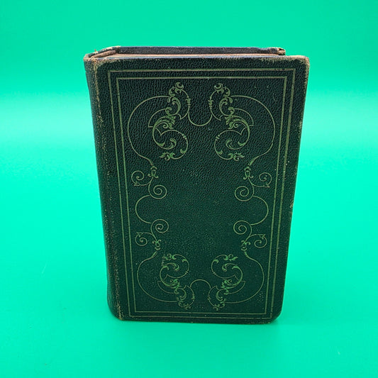antique German-language hymn book titled Sammlung von Geistlichen Liedern, published in 1858 in Cincinnati.