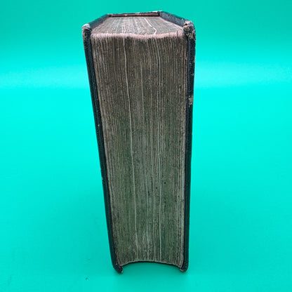 antique German-language hymn book titled Sammlung von Geistlichen Liedern, published in 1858 in Cincinnati.