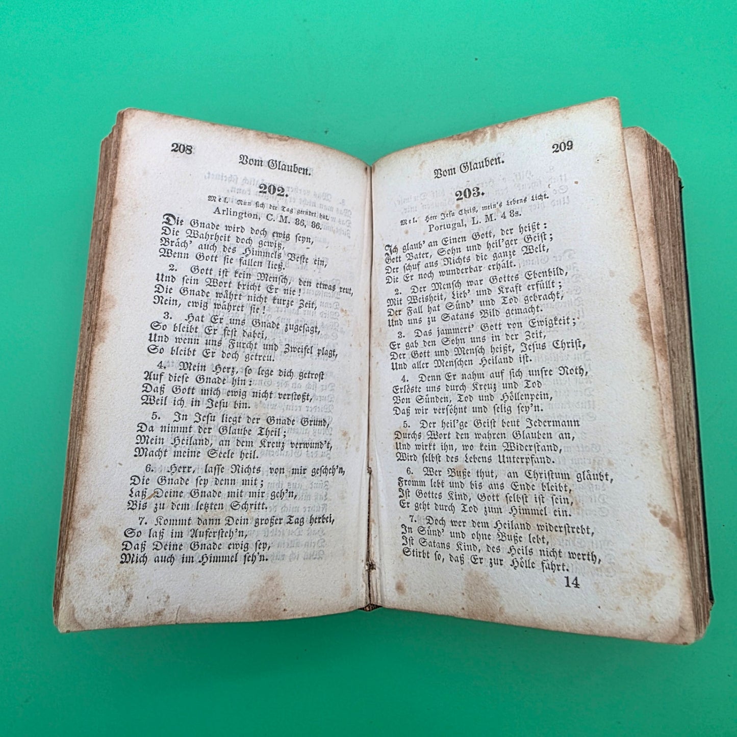 antique German-language hymn book titled Sammlung von Geistlichen Liedern, published in 1858 in Cincinnati.