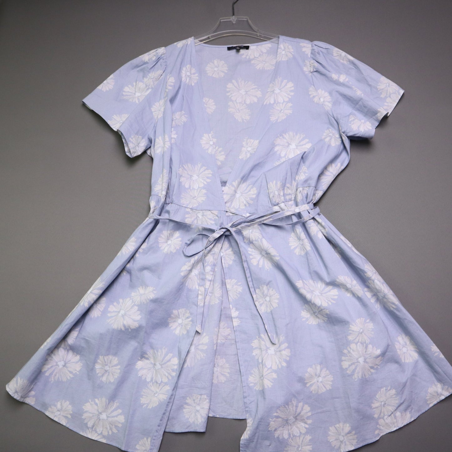 blue daisy floral wrap sundress is from Madewell and features short puff sleeves