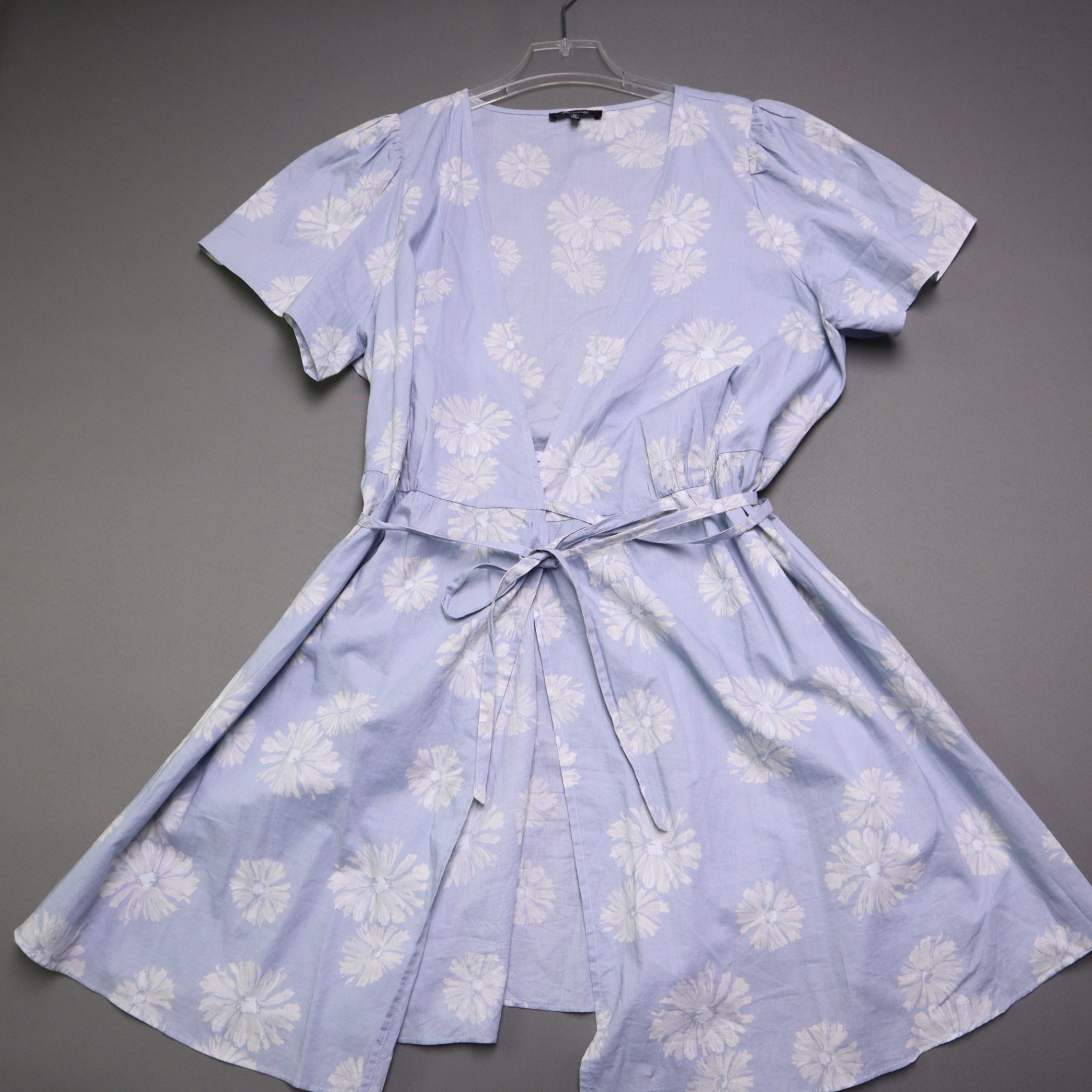 blue daisy floral wrap sundress is from Madewell and features short puff sleeves