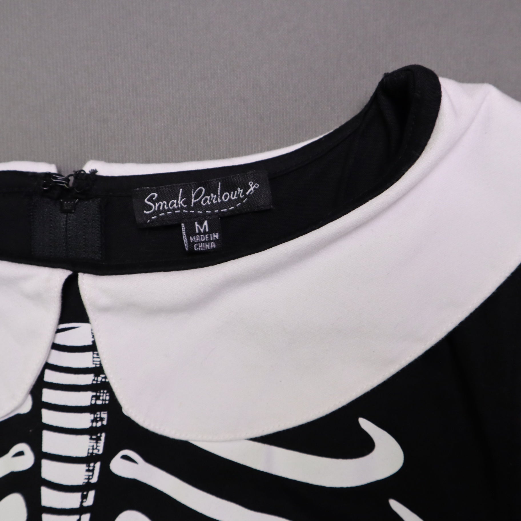 Smak Smak Parlour skeleton mod dress features a white Peter Pan collar and matching white pockets Online Only M