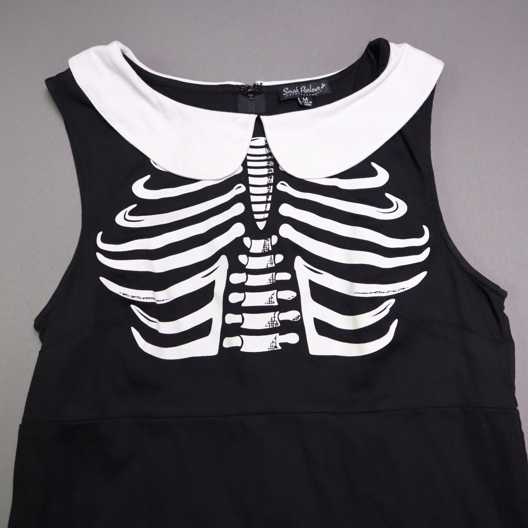 Smak Smak Parlour skeleton mod dress features a white Peter Pan collar and matching white pockets Online Only M