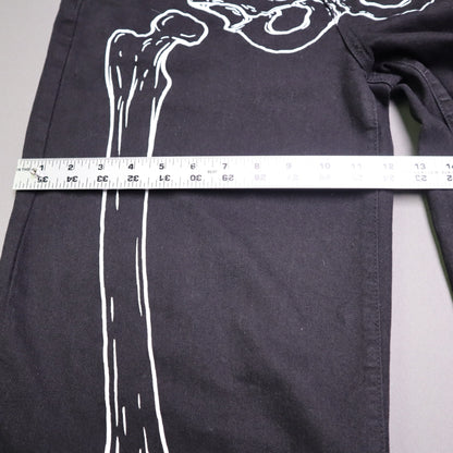 Hot Topic Black Skeleton Outline Wide Leg Pants feature a prominent white pelvic and leg bone print