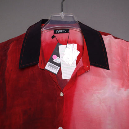 APNY brand button-up shirt features a vibrant red and pink gradient tie-dye pattern and a contrasting dark collar