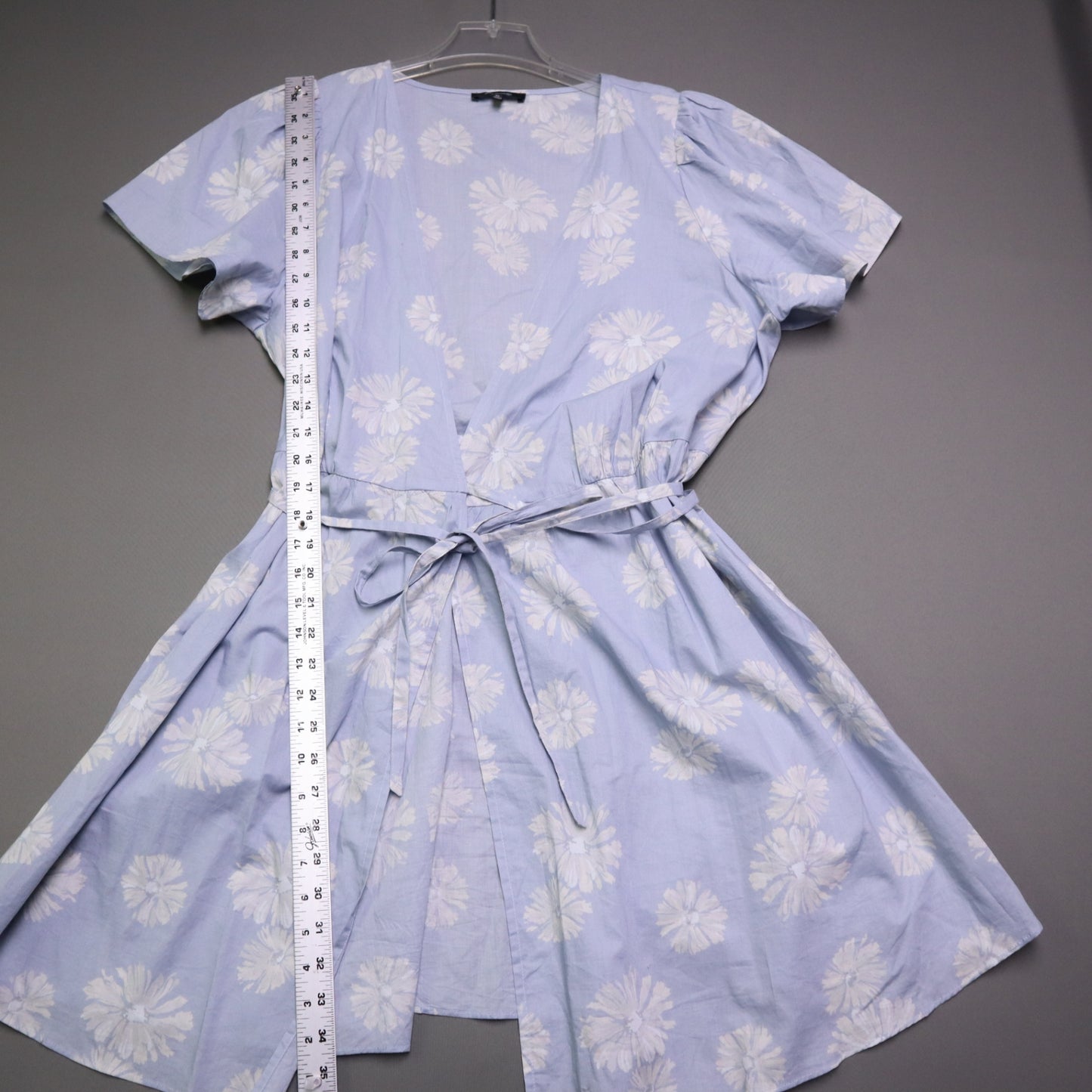 blue daisy floral wrap sundress is from Madewell and features short puff sleeves