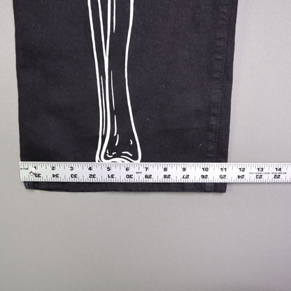 Hot Topic Black Skeleton Outline Wide Leg Pants feature a prominent white pelvic and leg bone print