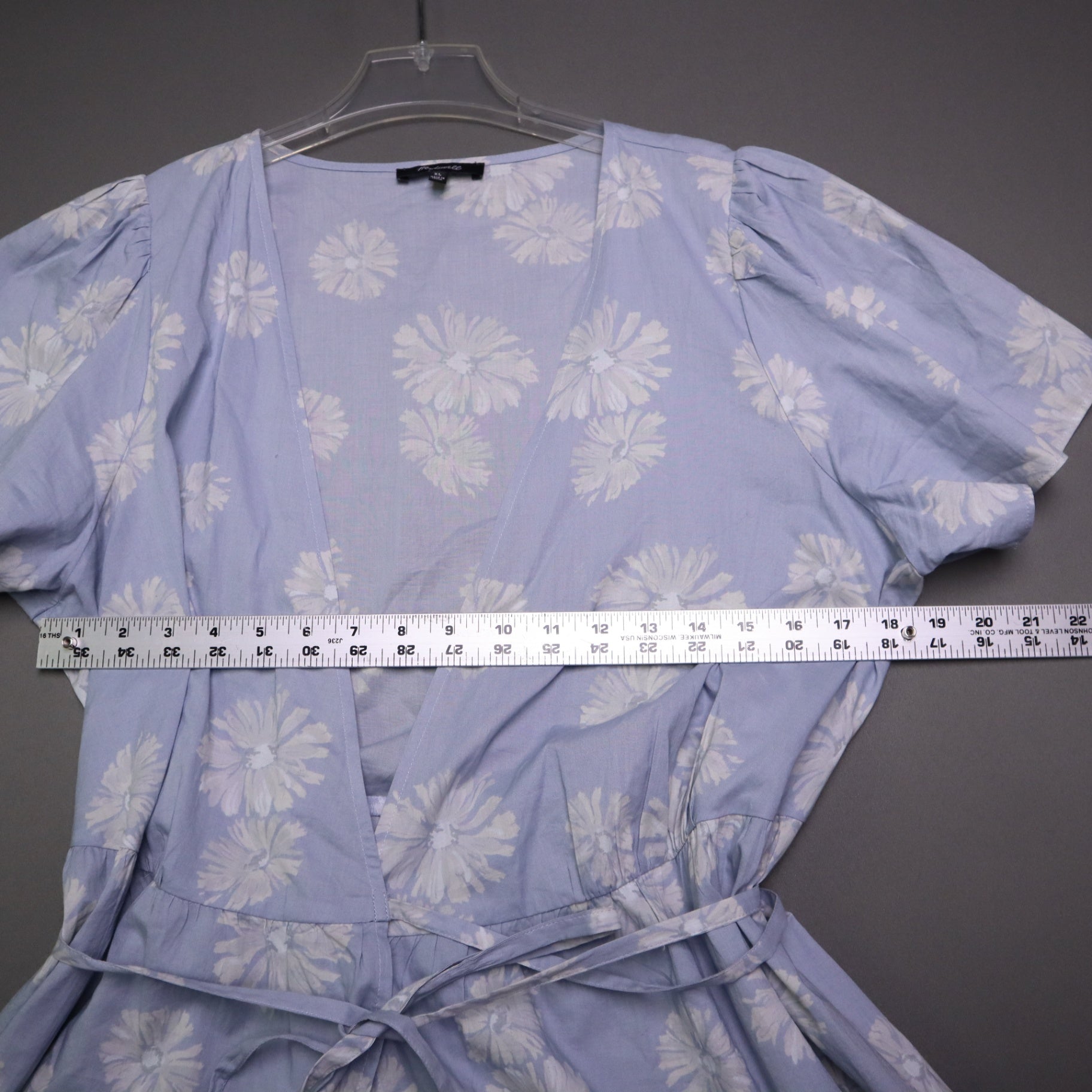 blue daisy floral wrap sundress is from Madewell and features short puff sleeves