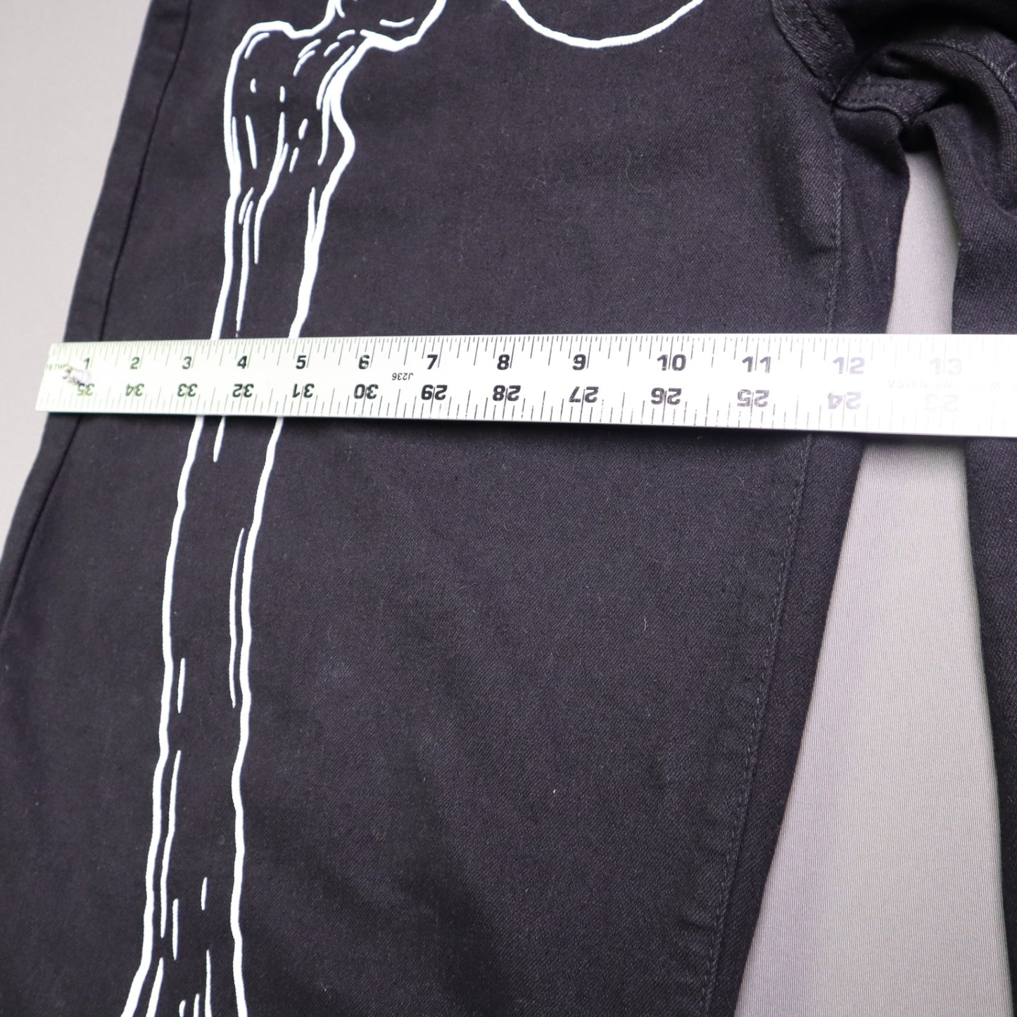 Hot Topic Black Skeleton Outline Wide Leg Pants feature a prominent white pelvic and leg bone print