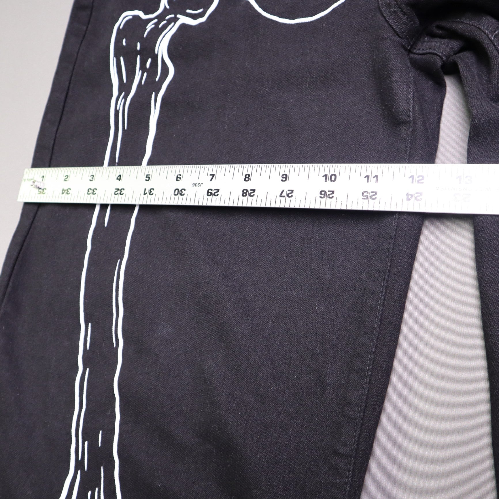 Hot Topic Black Skeleton Outline Wide Leg Pants feature a prominent white pelvic and leg bone print