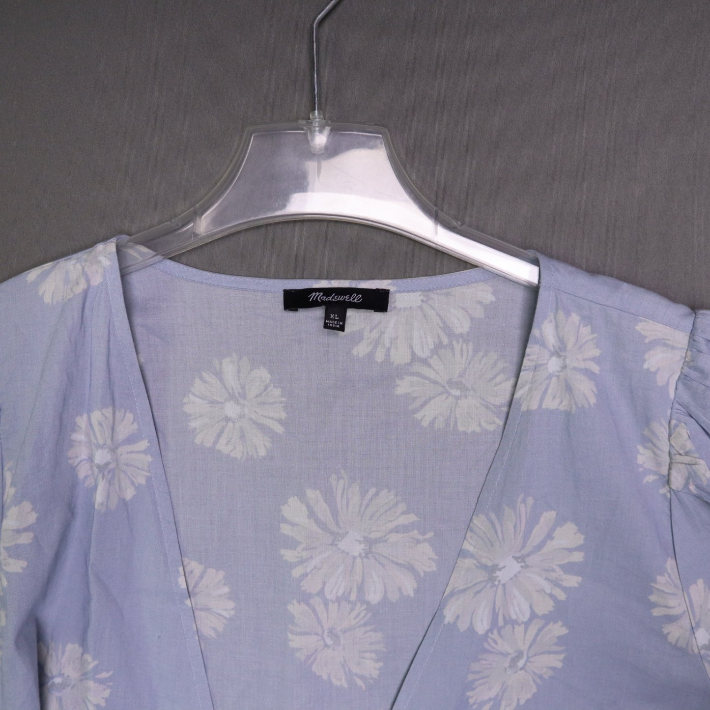 blue daisy floral wrap sundress is from Madewell and features short puff sleeves