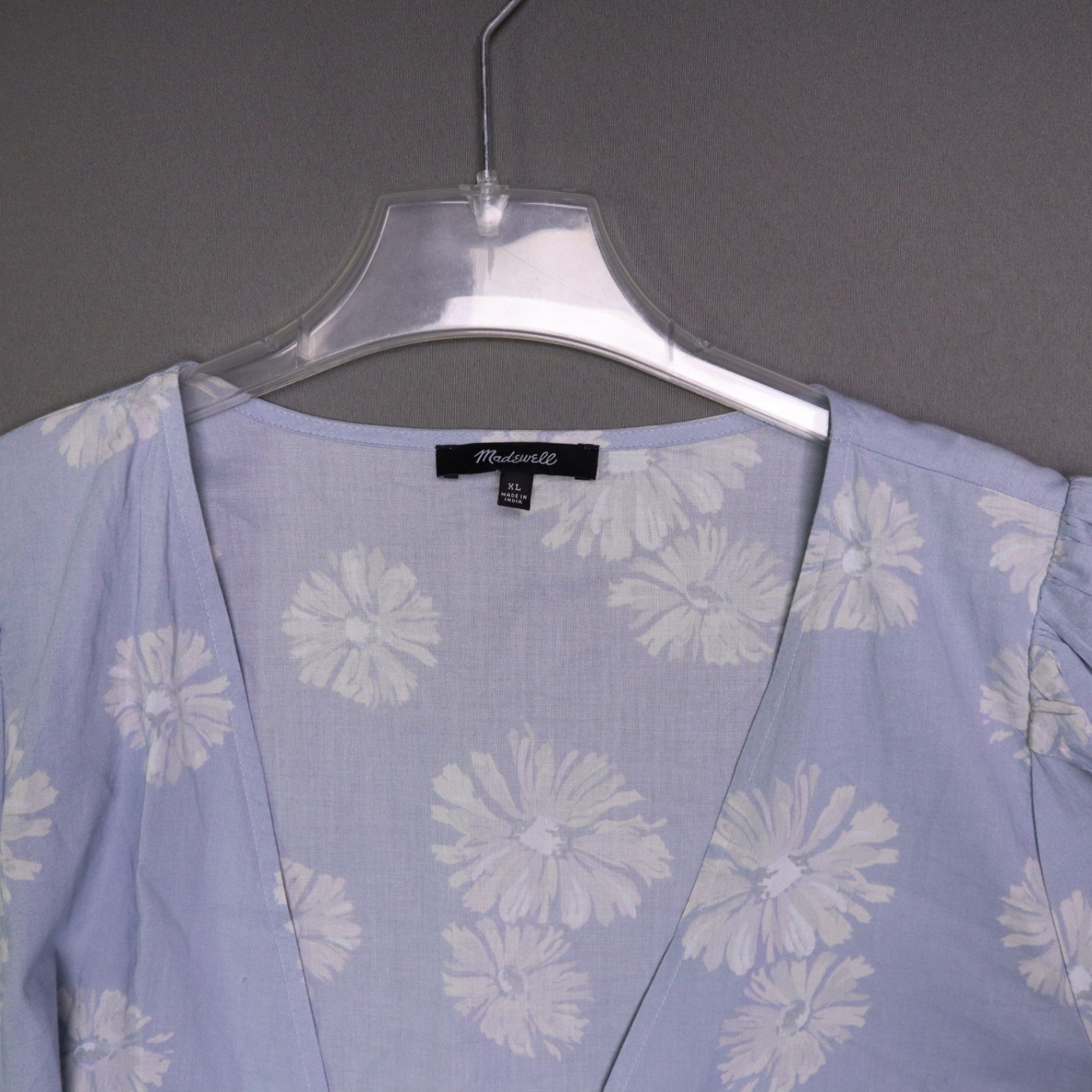 blue daisy floral wrap sundress is from Madewell and features short puff sleeves