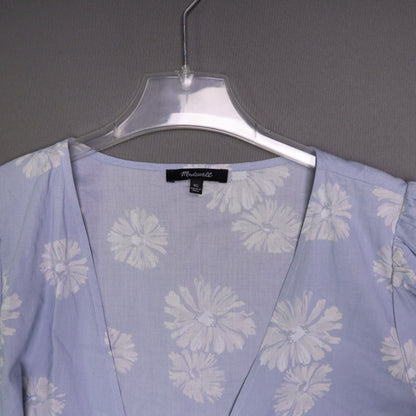 blue daisy floral wrap sundress is from Madewell and features short puff sleeves