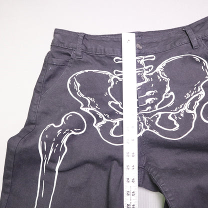 Hot Topic Black Skeleton Outline Wide Leg Pants feature a prominent white pelvic and leg bone print