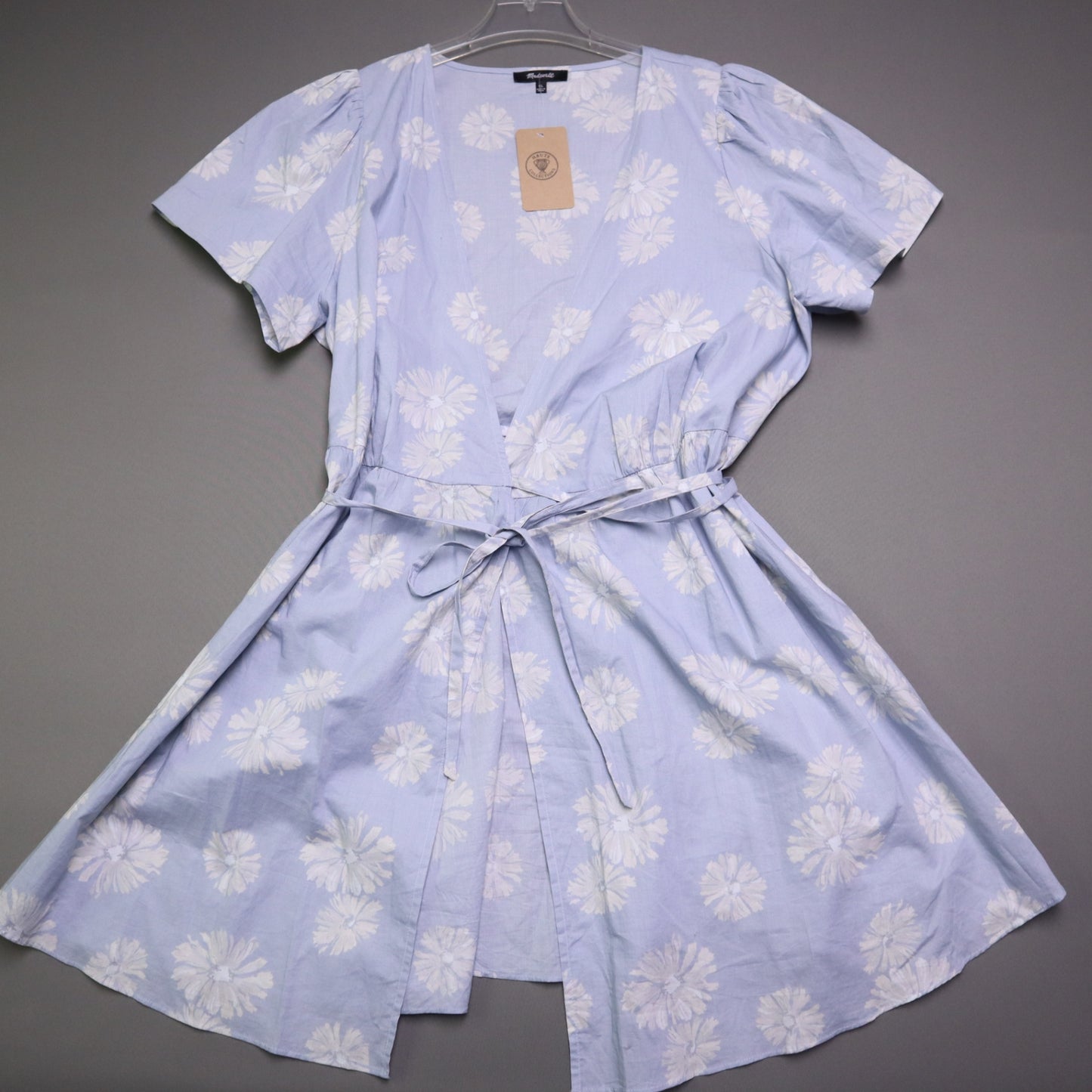 blue daisy floral wrap sundress is from Madewell and features short puff sleeves