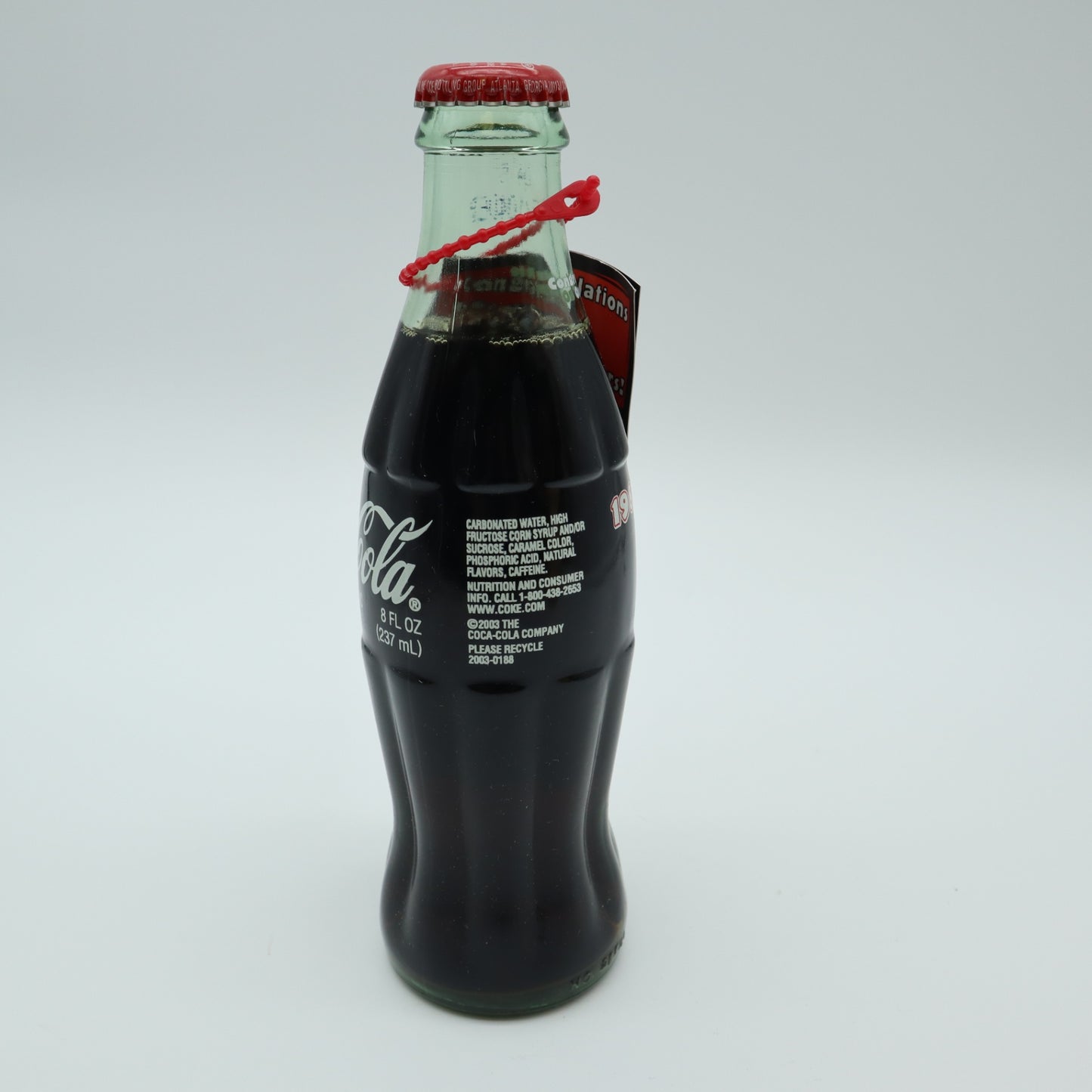 2003 Outback Steakhouse 15th Anniversary Coca Cola Bottle Tube Canister Hangtag