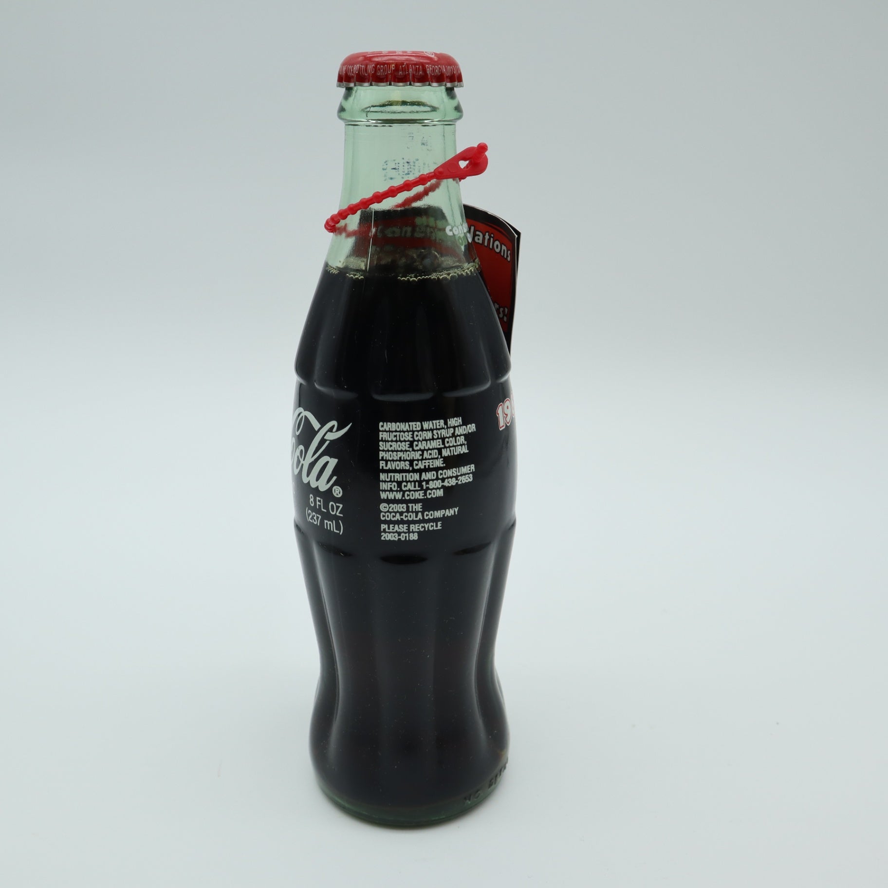 2003 Outback Steakhouse 15th Anniversary Coca Cola Bottle Tube Canister Hangtag