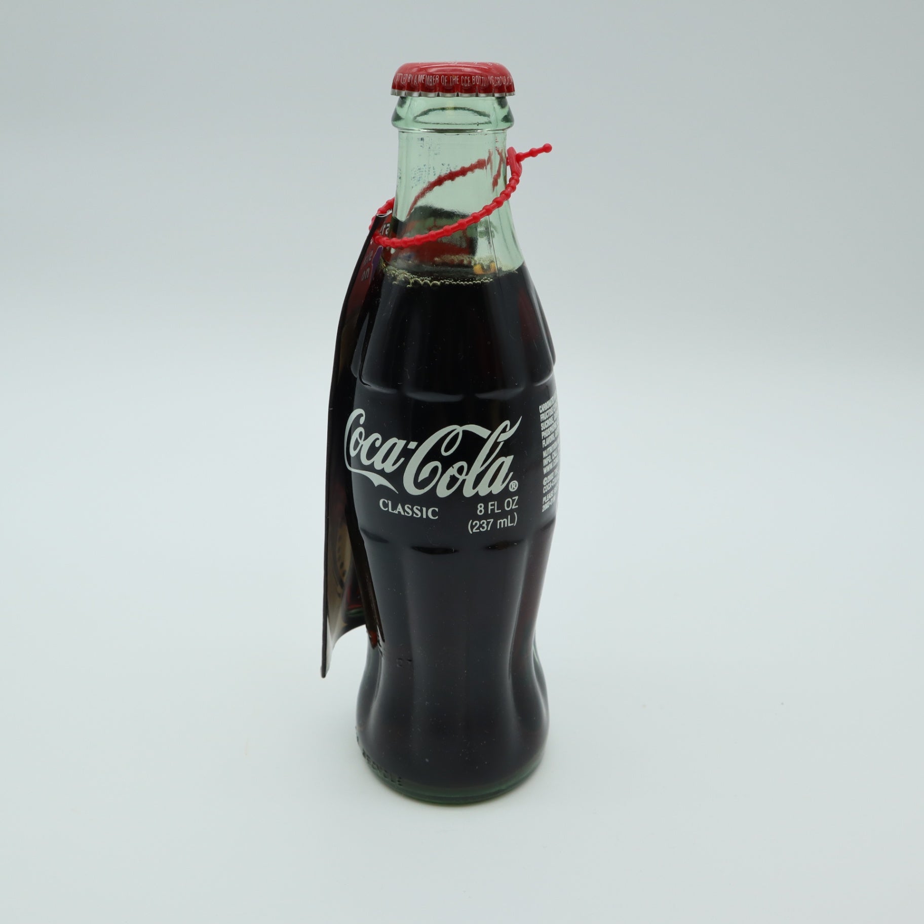 2003 Outback Steakhouse 15th Anniversary Coca Cola Bottle Tube Canister Hangtag