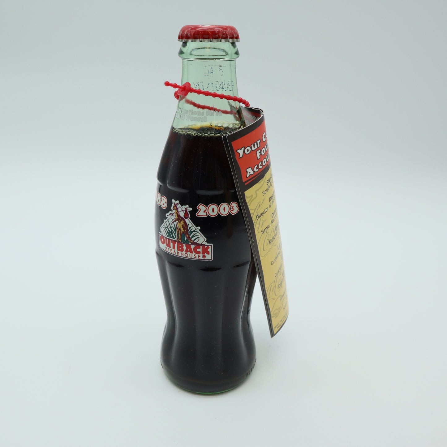 2003 Outback Steakhouse 15th Anniversary Coca Cola Bottle Tube Canister Hangtag